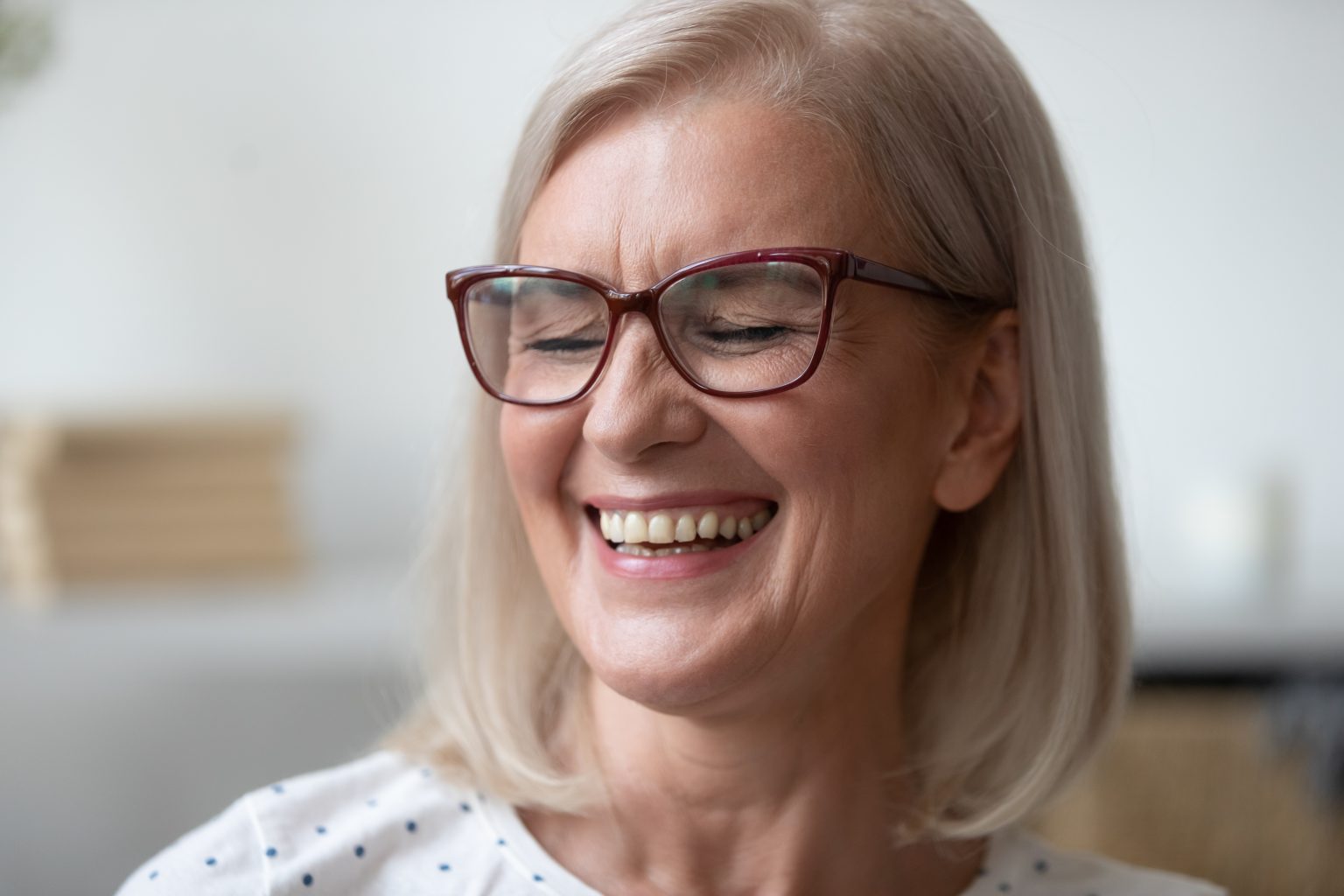 Close Up Of Happy Mature Woman Smiling Showing Teeth